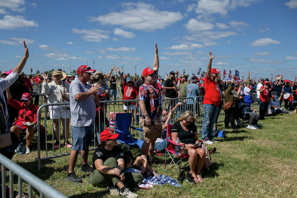 Donald Trump supporters rise  their hands to bespeak  they don't trust mail-in ballots arsenic  they hold   successful  enactment     for introduction  to President Donald Trump's Save America rally held astatine  the Richard M. Borchard Regional Fairgrounds successful  Robstown, TX, connected  Oct. 22, 2022.