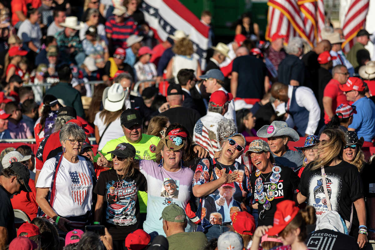 Supporters of Donald Trump join together in a sing-a-long of "Suspicious Minds" during President Donald Trump's Save America rally held at the Richard M. Borchard Regional Fairgrounds in Robstown, TX, on Oct. 22, 2022.