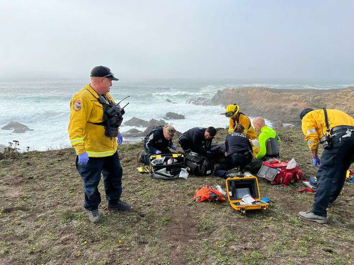 Medical personnel arrive in the area of Salt Point State Park after a boat carrying three people capsized Thursday afternoon.