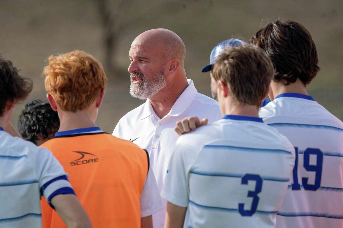 Marquette coach Brian Hoener talks to his team at halftime of season's Class 2A Triad Regional Tourney championship game in Troy. Hoener is the Small Schools Boys  Soccer Coach of the Year.