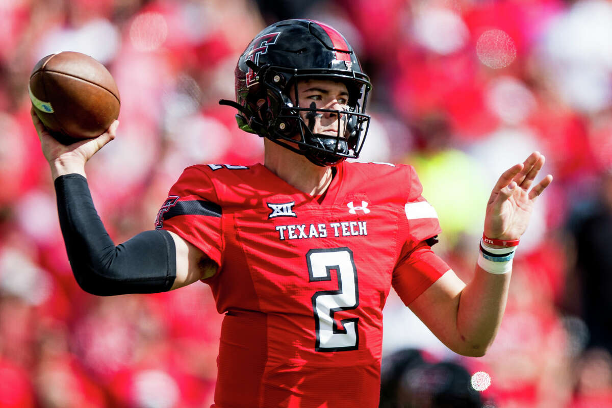 Quarterback Behren Morton of the Texas Tech Red Raiders passes the ball during the first half of the game against the West Virginia Mountaineers at Jones AT&T Stadium on October 22, 2022 in Lubbock. (Photo by John E. Moore III/Getty Images)