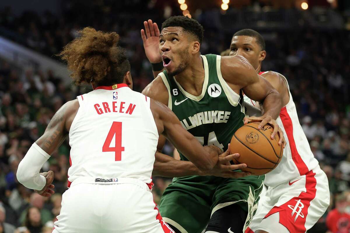 MILWAUKEE, WISCONSIN - OCTOBER 22: Giannis Antetokounmpo #34 of the Milwaukee Bucks is fouled by Jalen Green #4 of the Houston Rockets during the first half of a game at Fiserv Forum on October 22, 2022 in Milwaukee, Wisconsin. NOTE TO USER: User expressly acknowledges and agrees that, by downloading and or using this photograph, User is consenting to the terms and conditions of the Getty Images License Agreement.