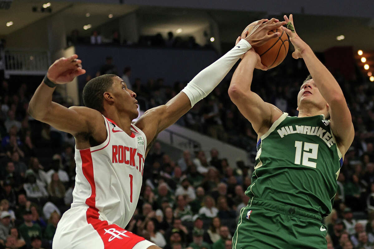 MILWAUKEE, WISCONSIN - OCTOBER 22: Jabari Smith Jr. #1 of the Houston Rockets blocks a shot by Grayson Allen #12 of the Milwaukee Bucks during the first half of a game at Fiserv Forum on October 22, 2022 in Milwaukee, Wisconsin. NOTE TO USER: User expressly acknowledges and agrees that, by downloading and or using this photograph, User is consenting to the terms and conditions of the Getty Images License Agreement. (Photo by Stacy Revere/Getty Images)