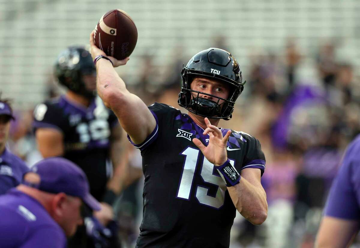 TCU quarterback Max Duggan (15) warms up before an NCAA college football game against Kansas State, Saturday, Oct. 22, 2022, in Fort Worth, Texas.