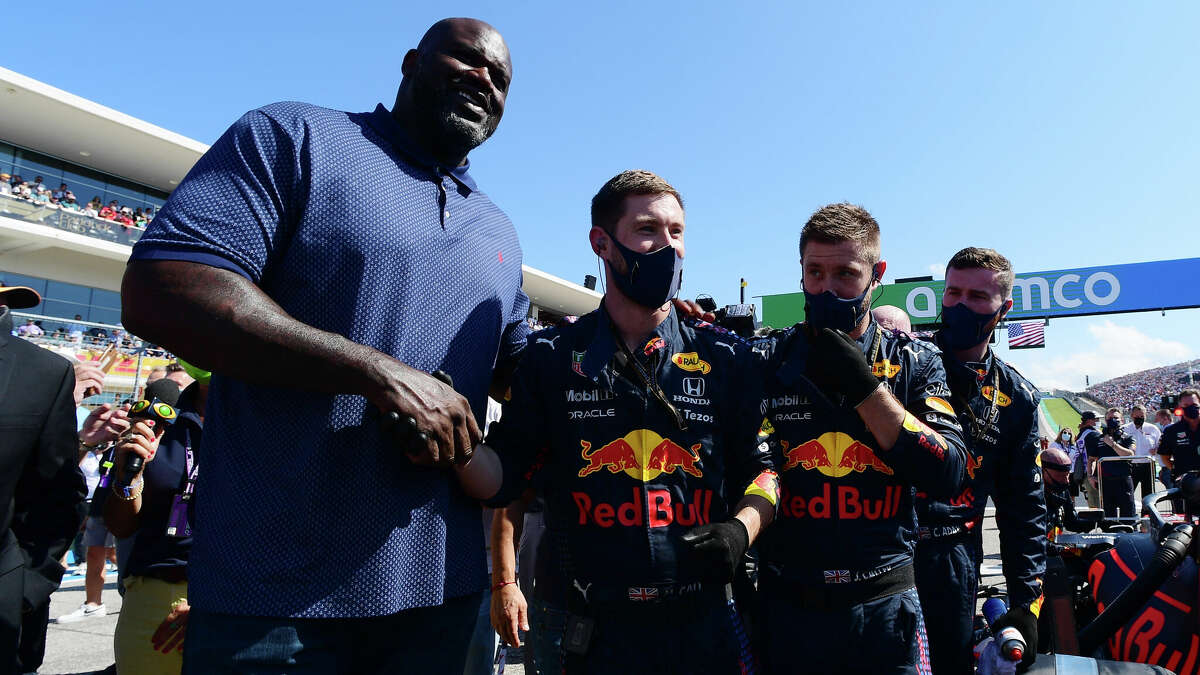 Shaquille O'Neal poses for a photo with the Red Bull Racing team on the grid before the F1 Grand Prix of the United States at Circuit of the Americas on October 24, 2021 in Austin, Texas.  (Photo by Mario Renzi - Formula 1/Formula 1 via Getty Images)