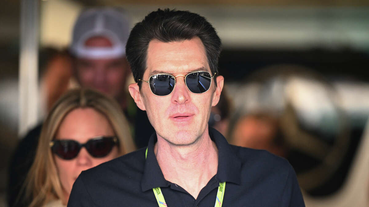 AUSTIN, TEXAS - OCTOBER 21: Joseph Kosinski walks through the paddock before practicing ahead of the F1 Grand Prix of the United States at Circuit of the Americas on October 21, 2022 in Austin, Texas.  (Photo by Clive Mason - Formula 1/Formula 1 via Getty Images)