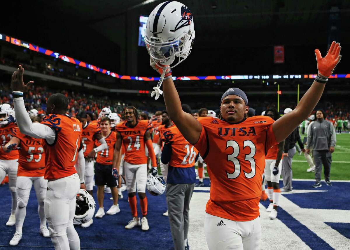 UTSA tight end Camron Cooper celebrates on the field after the Roadrunners beat North Texas 31-27 on Saturday at the Alamodome.