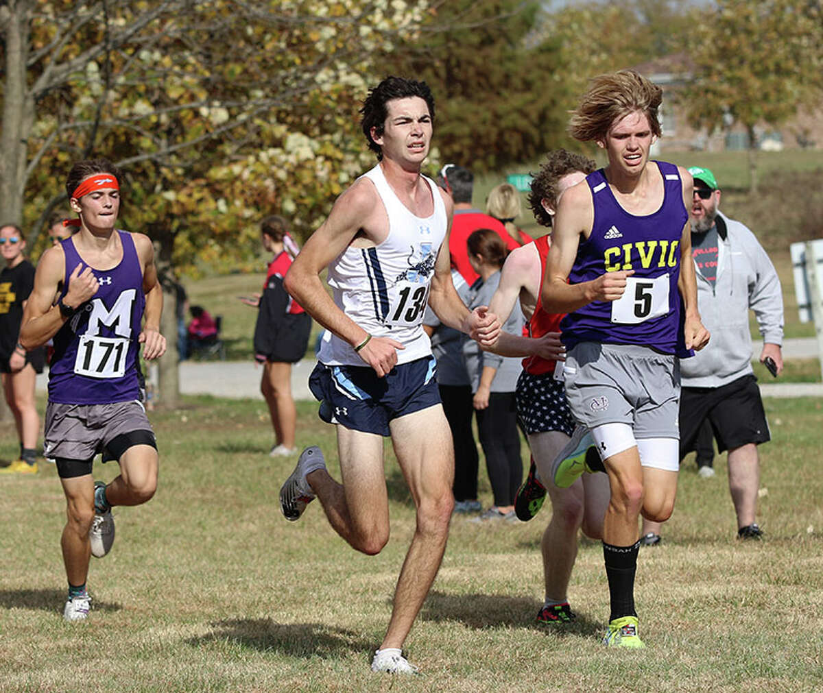 CM's Justice Eldridge (right) and Jersey's Griffin Williams (middle) lead Mascoutah's Andrew Latham to the finish line Saturday at the Highland Class 2A Regional at Firemen's Park in Alhambra.