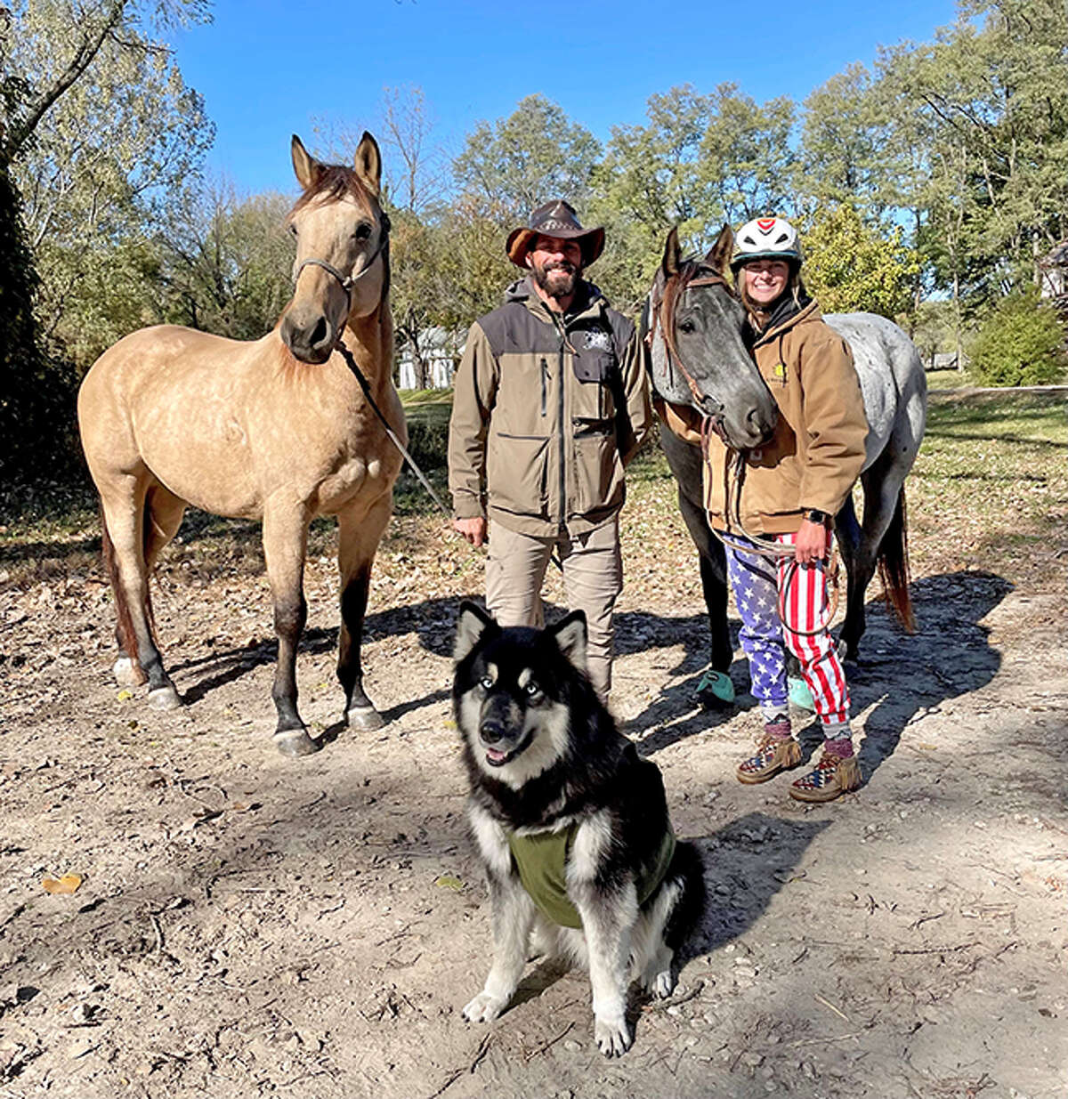 Matt Perella, left, his horse Buck, along with Grace Heepke, her horse Goose and Perella’s dog Raffe, pose for a photo during their trip together. Heepke, a junior at Edwardsville High School, spent a week riding with Perella, who is traveling across the U.S. to raise awareness and funds for Righteous Life Rescue Ranch.