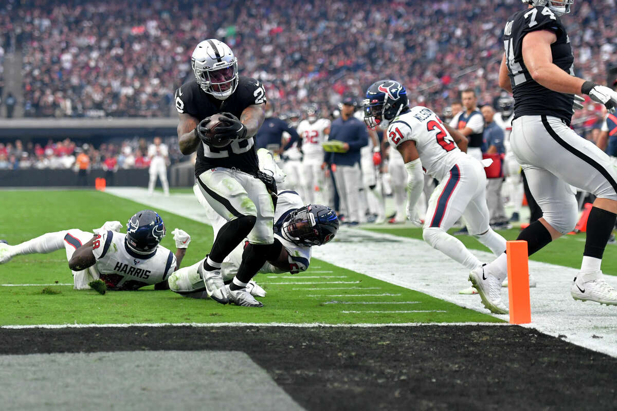 Las Vegas Raiders running back Josh Jacobs scores a touchdown during the second half of an NFL football game against the Houston Texans, Sunday, Oct. 23, 2022, in Las Vegas. (AP Photo/David Becker)