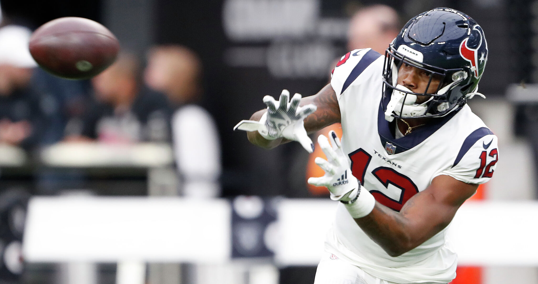 HOUSTON, TX - NOVEMBER 20: Houston Texans wide receiver Nico Collins (12)  holds on to the ball