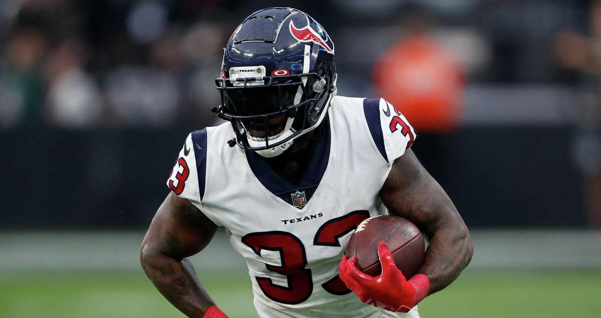 Dare Ogunbowale #33 of the Houston Texans carries the ball in the fourth quarter against the Las Vegas Raiders at Allegiant Stadium on October 23, 2022 in Las Vegas, Nevada. (Photo by Steve Marcus/Getty Images)