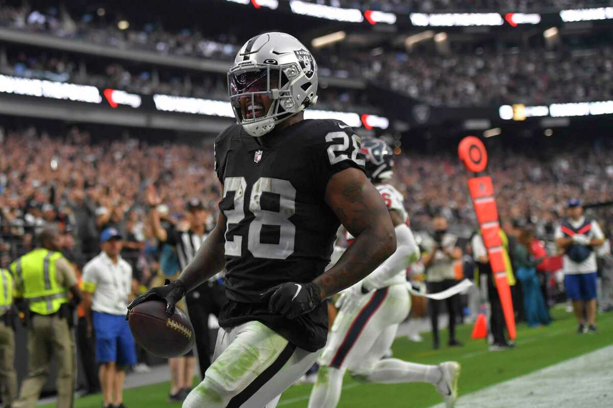 Raiders running back Josh Jacobs, who recorded his third straight game with more than 100 yards rushing, scores one of his three TDs in the second half.