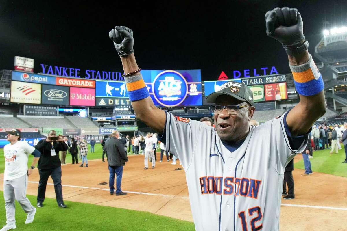 Houston Astros manager Dusty Baker Jr. (12) reacts toward fans after winning the American League pennant following a sweep of the New York Yankees at Yankee Stadium on Sunday, Oct. 23, 2022, in New York.
