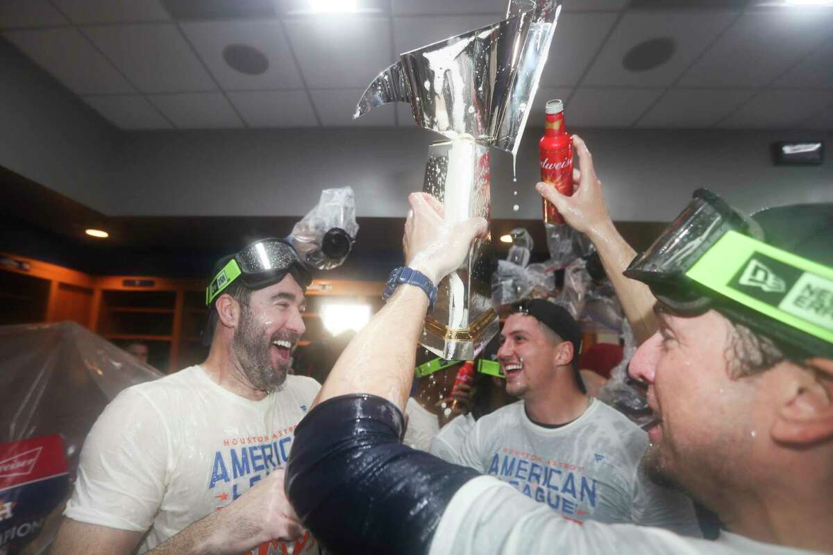 Houston Astros pitcher Justin Verlander, left, celebrates after sweeping the New York Yankees in the American League Championship Series on Sunday, Oct. 23, 2022, in New York.