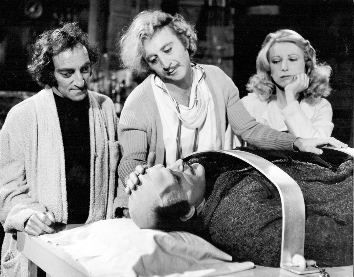 Actors Marty Feldman (from left), Gene Wilder, Peter Boyle and Teri Garr share a scene in the 1974 Mel Brooks movie "Young Frankenstein."