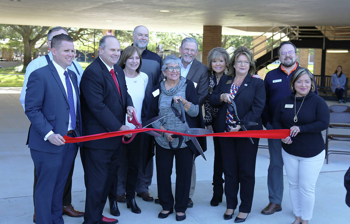 Alvin Community College regents and Alvin-Manvel Area Chamber of Commerce representatives cut the ribbon during a grand reopening ceremony for the college on Oct. 20.