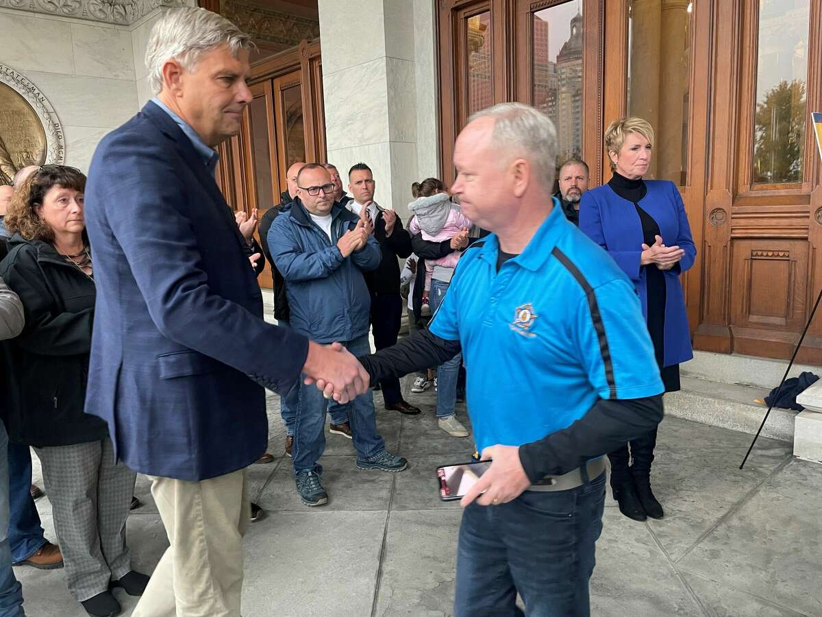 Bob Stefanowski shakes hands with Det. Sgt. John Krupinsky, president of Connecticut State Fraternal Order of Police, which endorsed Stefanowski for governor and his running mate, Laura Devlin for lieutenant governor this spring. 