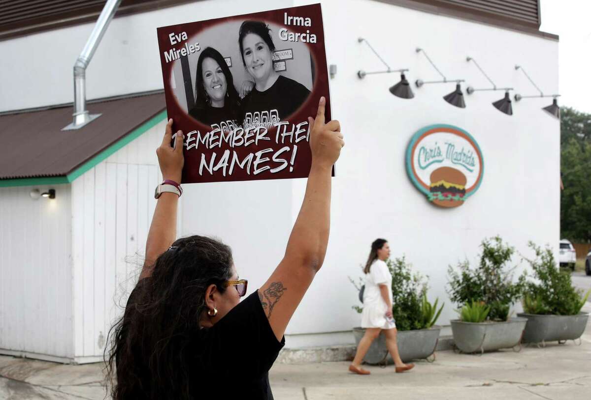 Beto O'Rourke supporters including Rosie Garcia, cousin of Eva Mireles, one of the teachers killed in Uvalde, gather near the corner of Blanco and W. Rosewood, across the street from Chris Madrids Restaurant where Texas Gov. Greg Abbott held a rally on Monday, Oct. 24, 2022, the first day of early voting.