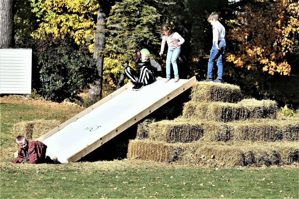 Children play on a hay slide Saturday at Manistee National Golf & Resort's inaugural HayDay event.
