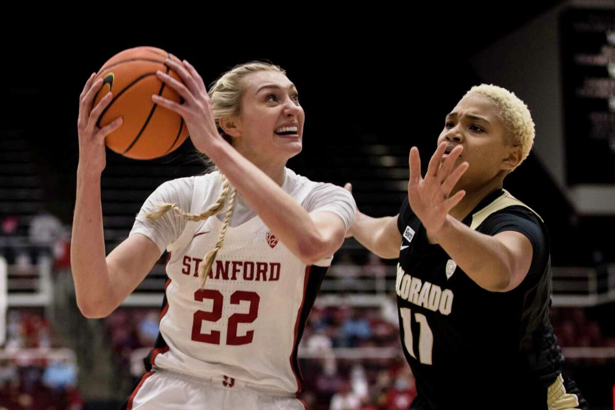 Stanford forward Cameron Brink (22) drives past Colorado guard Tayanna Jones, right, during the first half of an NCAA college basketball game Sunday, Feb. 13, 2022, in Stanford, Calif. (AP Photo/John Hefti)