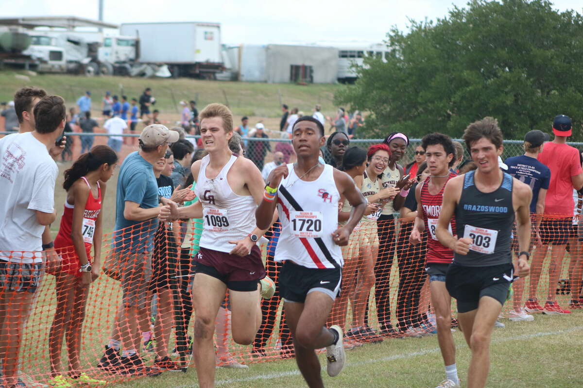 South Houston's Jeremiah Horton (1720) attempts to keep a Cinco Ranch and Brazoswood runner at bay as he heads for the finish line during Monday morning's Region III race in Huntsville.