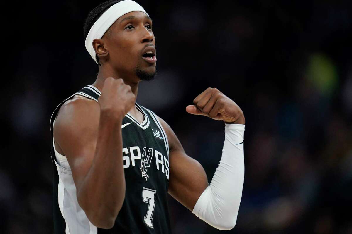 San Antonio Spurs guard Josh Richardson (7) celebrates after a Spurs basket during the second half of an NBA basketball game against the Minnesota Timberwolves, Monday, Oct. 24, 2022, in Minneapolis. (AP Photo/Abbie Parr)