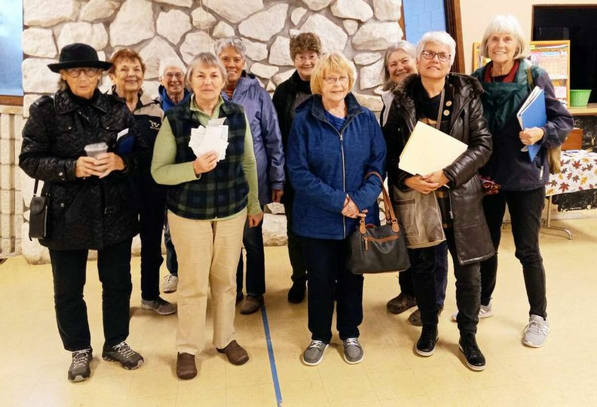 Several women who attend the October 2022 meeting of 100 Women Who Care Manistee County present Jan Thomas and the Arts and Cultural Alliance of Manistee County with their quarterly donation. The meeting was held at the Wagoner Community Center.