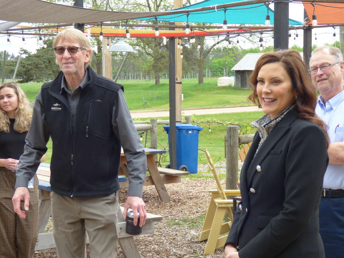 Richard Anderson co-owner of Iron Fish Distillery meets with Governor Gretchen Whitmer at his Thompsonville-based business in May 2022. Whitmer highlighted the distillery as a example of small busines growth.