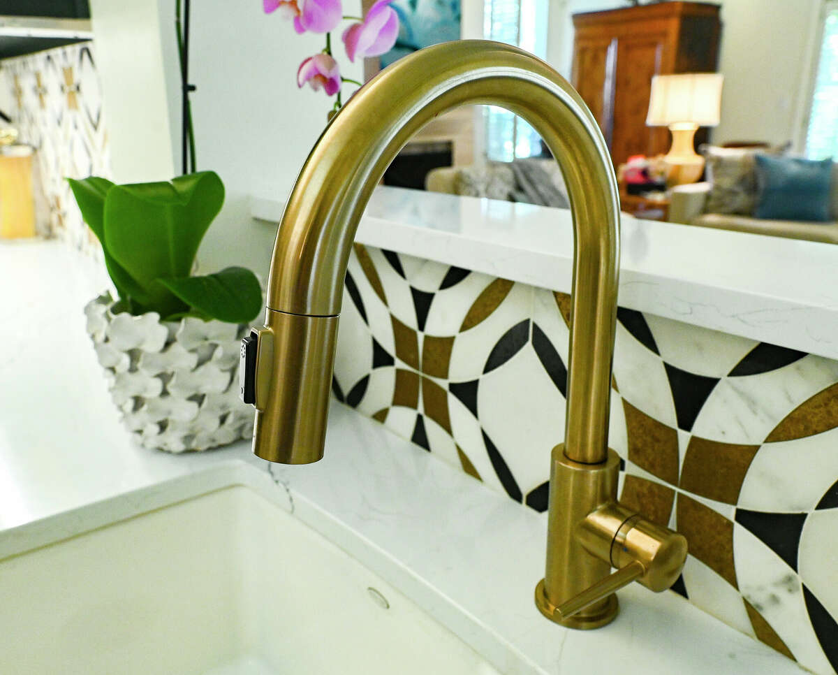 This is a closeup of the eye-catching backsplash and sink hardware.