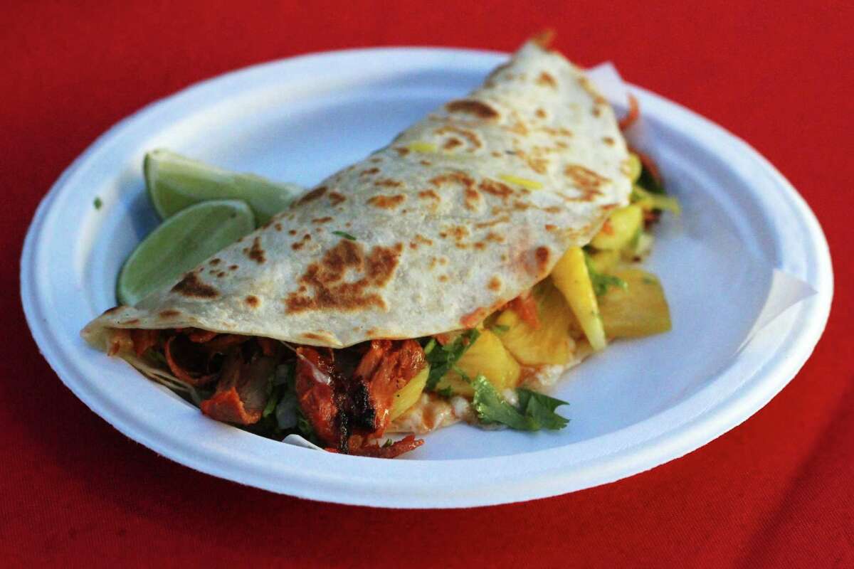Gringa, a quesadilla of sorts with paper-thin al pastor and pineapple shards from Tacos Al Pastor Puebla