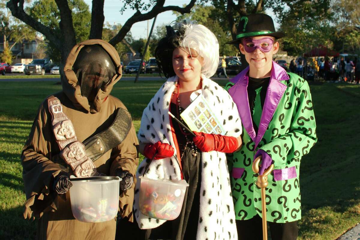 Jonah Thomas, Trinity Hester and Elijah Thomas wear their costumes at a previous Trick or Treat Trail at Pearland's Independence Park.