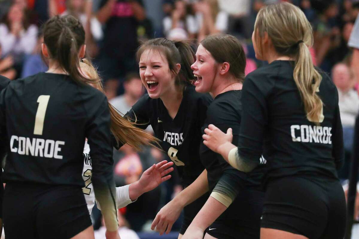 Conroe’s Brooklyn Spikes (8) reacts after scoring a point in the first set of a District 13-6A high school volleyball match at College Park High School, Tuesday, Oct. 25, 2022, in The Woodlands.