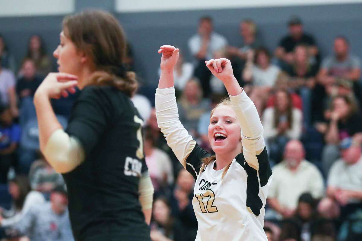 Conroe’s Emma Malak (12) celebrates a point in the first set of a District 13-6A high school volleyball match at College Park High School, Tuesday, Oct. 25, 2022, in The Woodlands.