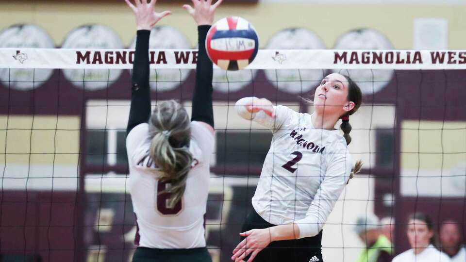 Magnolia's Chloe Richards (2) gets a shot past Magnolia West's Hailey Holmes (6) in the third set of a District 21-5A high school volleyball match at Magnolia West High School, Tuesday, Oct. 25, 2022, in Magnolia.