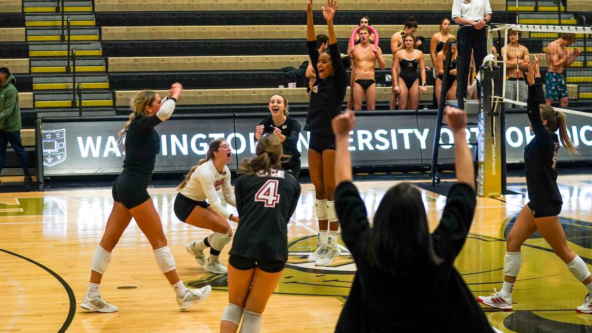 The Cougars celebrate their five-set comeback win over Ohio Valley Conference opponent Lindenwood on Tuesday. 