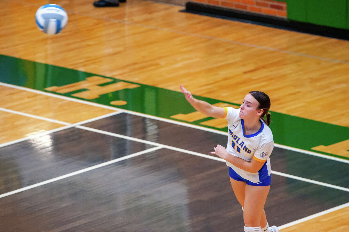 The Dow and Midland high-level volleyball teams face off in a rivalry matchup Oct. 25 at Dow High School.