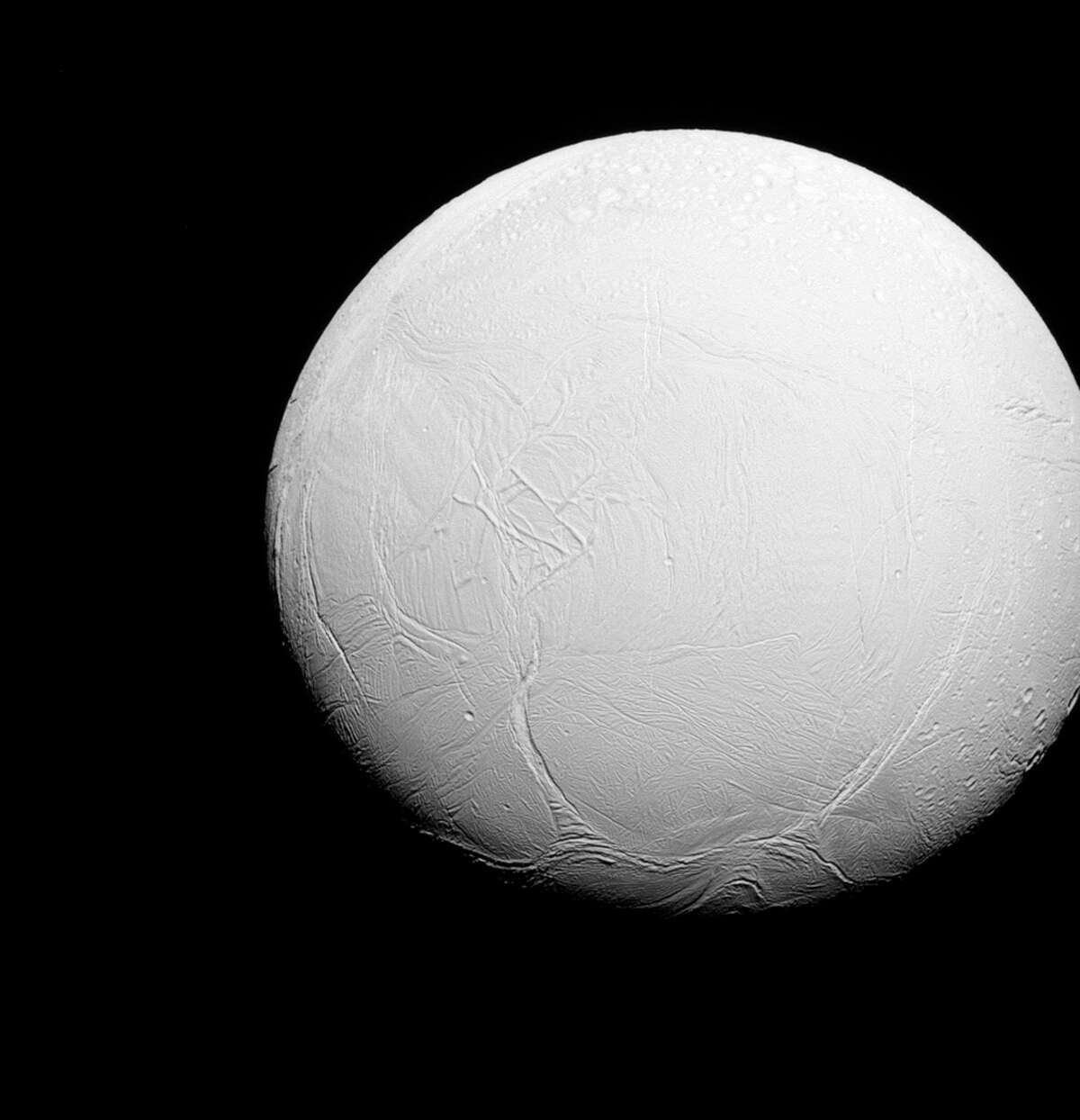 This July 2015 photo taken by the Cassini spacecraft shows the moon Enceladus orbiting Saturn.