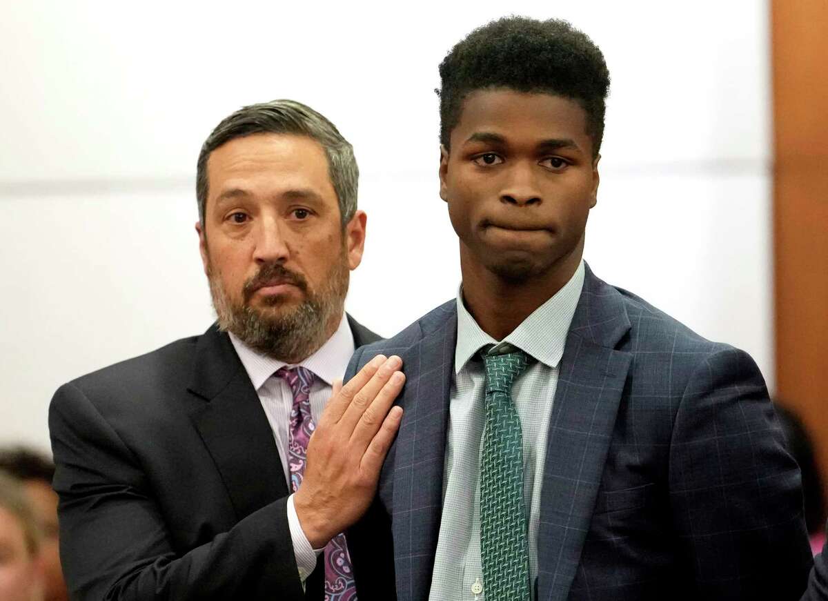 Rick DeToto, defense attorney, left, and his client Antonio Armstrong Jr., react in the 178th District Criminal Court after a mistrial is declared in his capital murder trial Wednesday, Oct. 26, 2022, in Houston. Armstrong is accused of killing his parents in 2016.