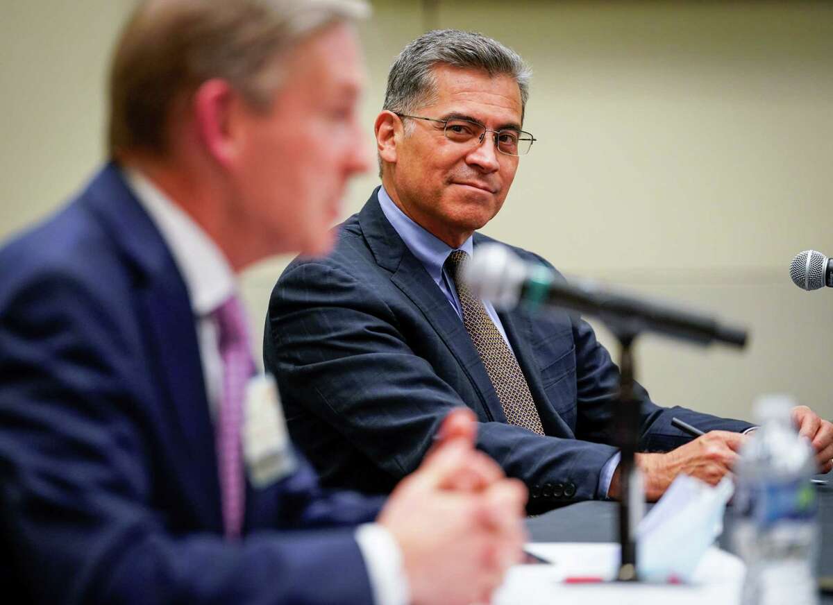 U.S. Secretary of Health and Human Services Xavier Becerra listens as Dr. Peter Pisters, president of MD Anderson Cancer Center, speaks during a press conference about the “Cancer Moonshot” program Wednesday, Oct. 26, 2022, at the Duncan Family Institute for Cancer Prevention and Risk Assessment, part of the MD Anderson Cancer Center system, in Houston.