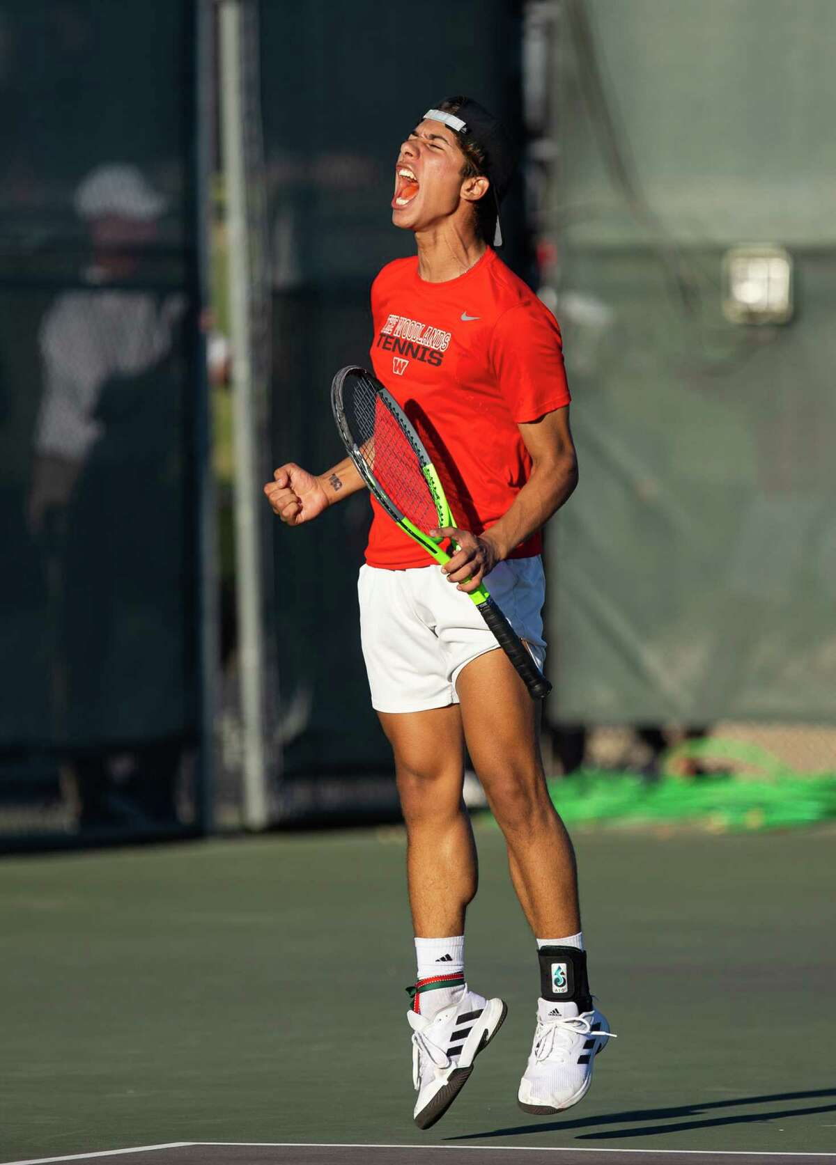 The Woodlands’ Jose Perez celebrates during a doubles match with partner Felipe Rameriz against Memorial’s Christopher Langford and Nate Raney in the Class 6A tennis state championship semifinals at the George P. Mitchell and Omar Smith Intramural Tennis Centers at Texas A&M University in College Station on Wednesday, October 26, 2022. Perez and Rameriz won the match 6-3, 7-6(2). (Cassie Stricker / The Chronicle)