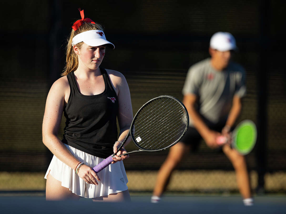 Memorial’s Grace Vulliez, left, and partner Alex Ventura wait for the serve during a mixed doubles match against The Woodlands’ Carson Moore and Maryia Tryhubovich in the Class 6A tennis state championship semifinals at the George P. Mitchell and Omar Smith Intramural Tennis Centers at Texas A&M University in College Station on Wednesday, October 26, 2022. (Cassie Stricker / The Chronicle)