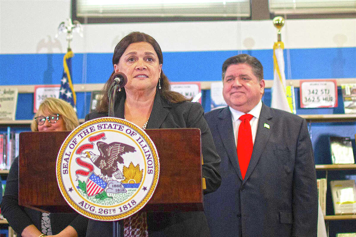 Illinois State Board of Education Superintendent Carmen Ayala attends an event in Springfield with Gov. J.B. Pritzker.