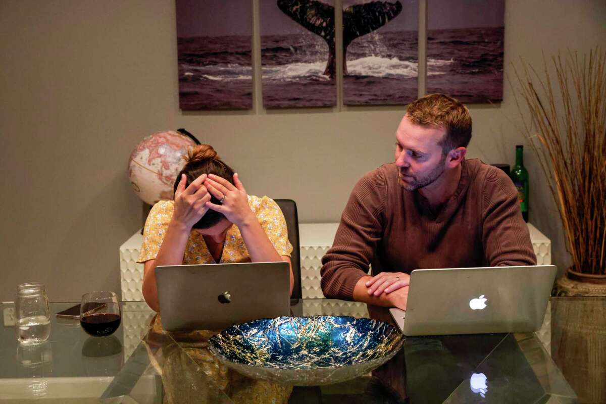 Geri and Zach Landman, at the family’s home in Danville, work on their nonprofit to find therapies for daughter Lucy’s genetic disorder.
