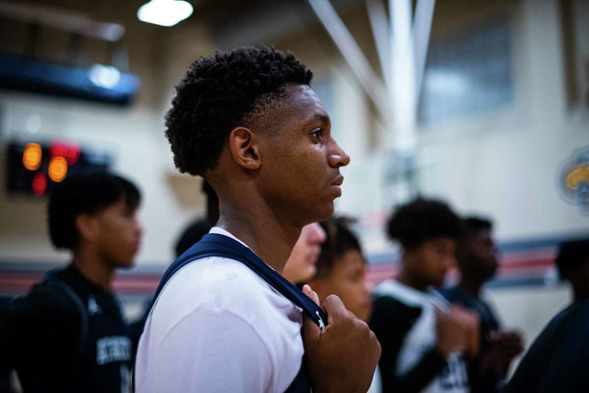 Atascocita High School junior and varsity basketball player, Jerrell Barron Jr. listens to Coach Martinez during an end of practice team huddle on Wednesday, October 26, 2022 in Humble, Texas. (Meridith Kohut / For the Houston Chronicle)