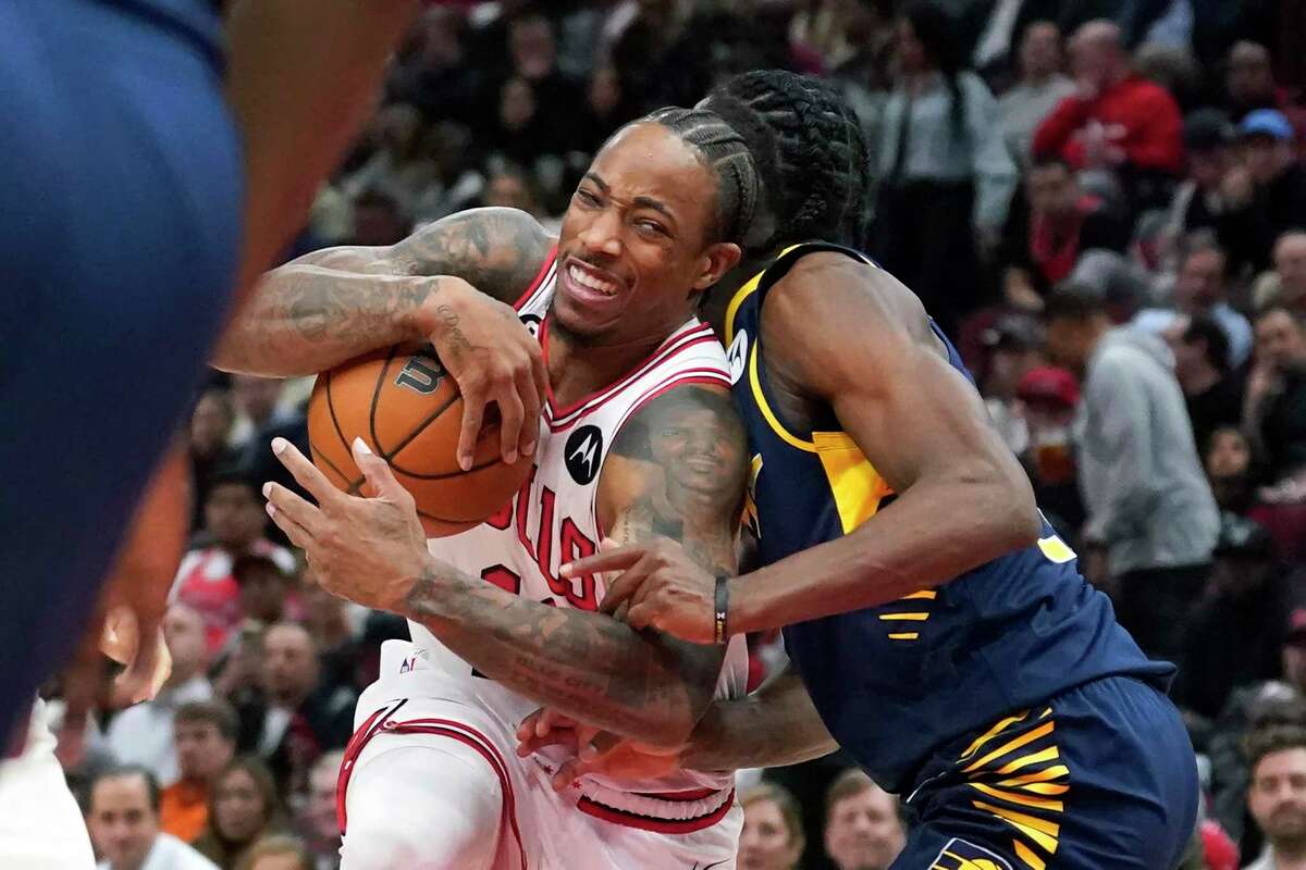 Chicago Bulls' DeMar DeRozan drives to the basket as Indiana Pacers' Buddy Hield defends during the second half of an NBA basketball game Wednesday, Oct. 26, 2022, in Chicago. The Bulls won 124-109. (AP Photo/Charles Rex Arbogast)