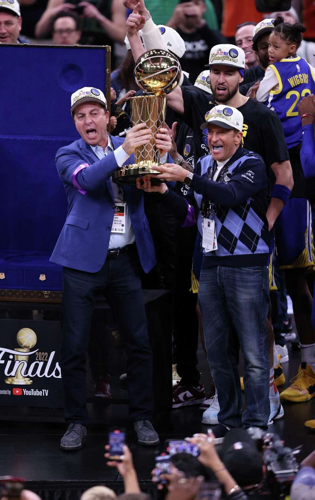 Golden State Warriors Joe Lacob, Peter Guber and Klay Thompson celebrate the team’s NBA Championship after a 103-90 win over Boston Celtics in Game 6 of NBA Finals in June.