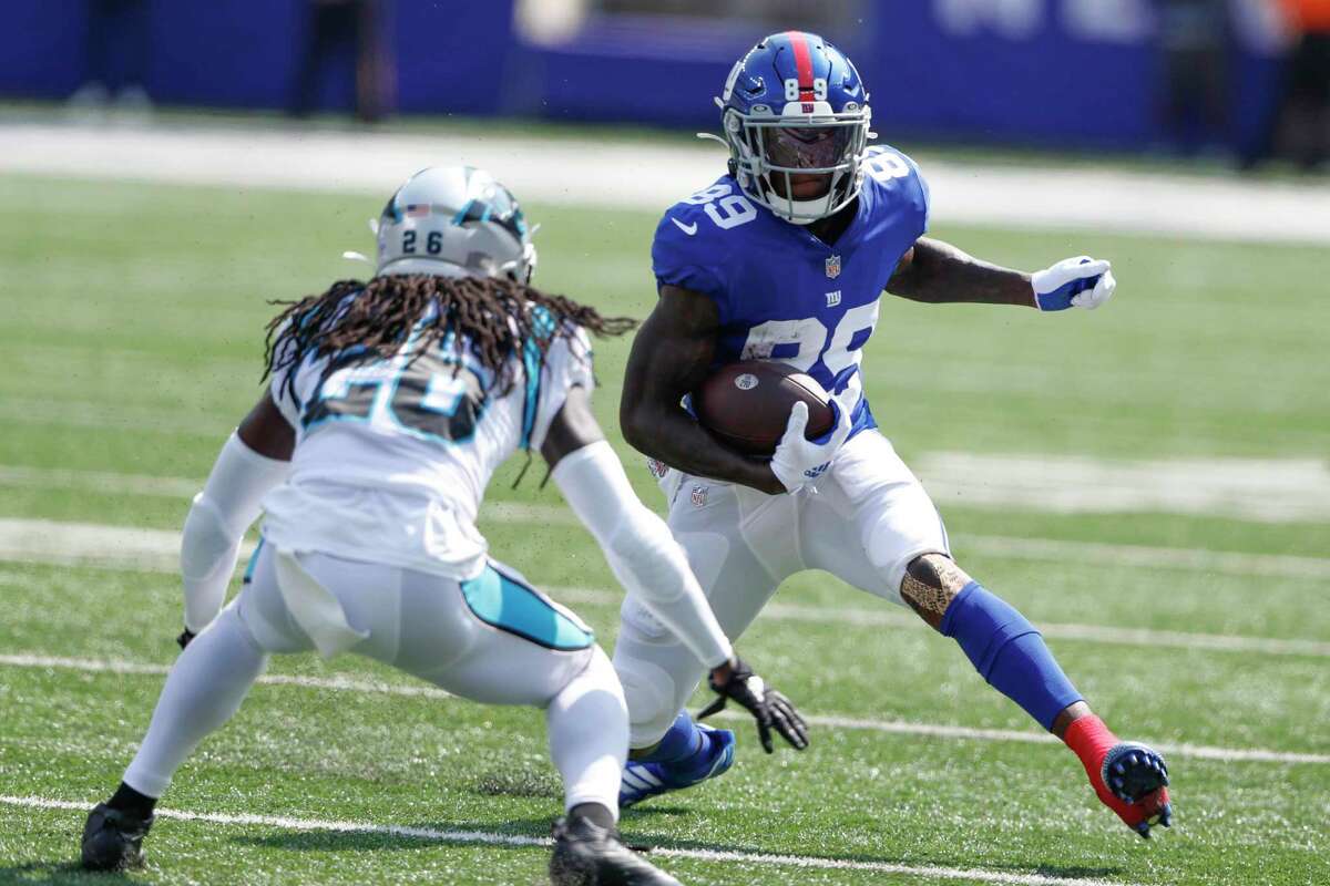 FILE - New York Giants' Kadarius Toney, right, runs with the ball during the first half an NFL football game against the Carolina Panthers, on Sept. 18, 2022, in East Rutherford, N.J. The Kansas City Chiefs acquired Giants wide receiver Kadarius Toney on Thursday, Oct. 27, 2022, for a pair of picks in next year's draft, a person familiar with the terms of the trade told The Associated Press. (AP Photo/Noah K. Murray, File)