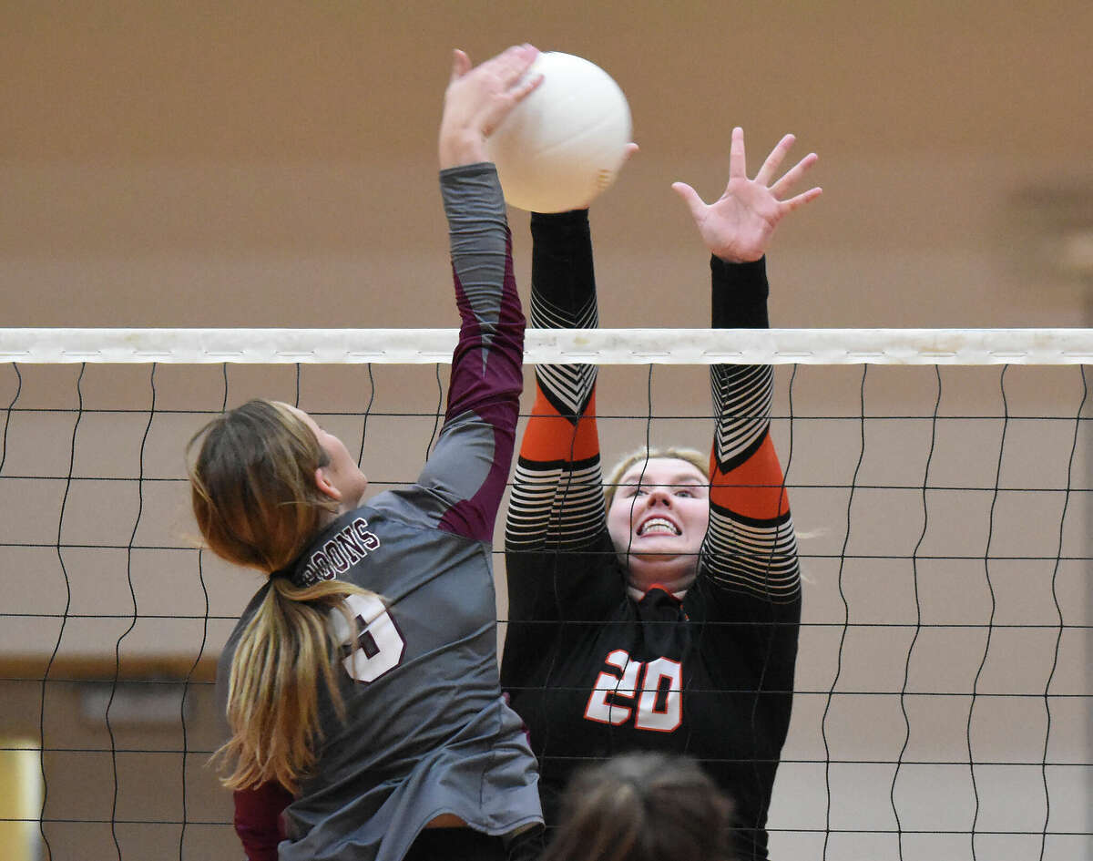 Edwardsville's Claire Dunivan with a block against Belleville West on Thursday in the Class 4A Edwardsville Regional championship match inside Lucco-Jackson Gymnasium in Edwardsville.