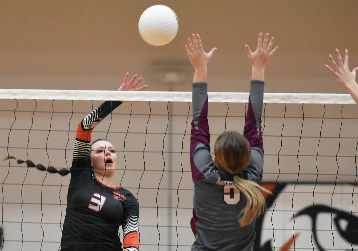 Edwardsville's Ava Waltenberger with an attack against Belleville West on Thursday in the Class 4A Edwardsville Regional championship match inside Lucco-Jackson Gymnasium in Edwardsville.